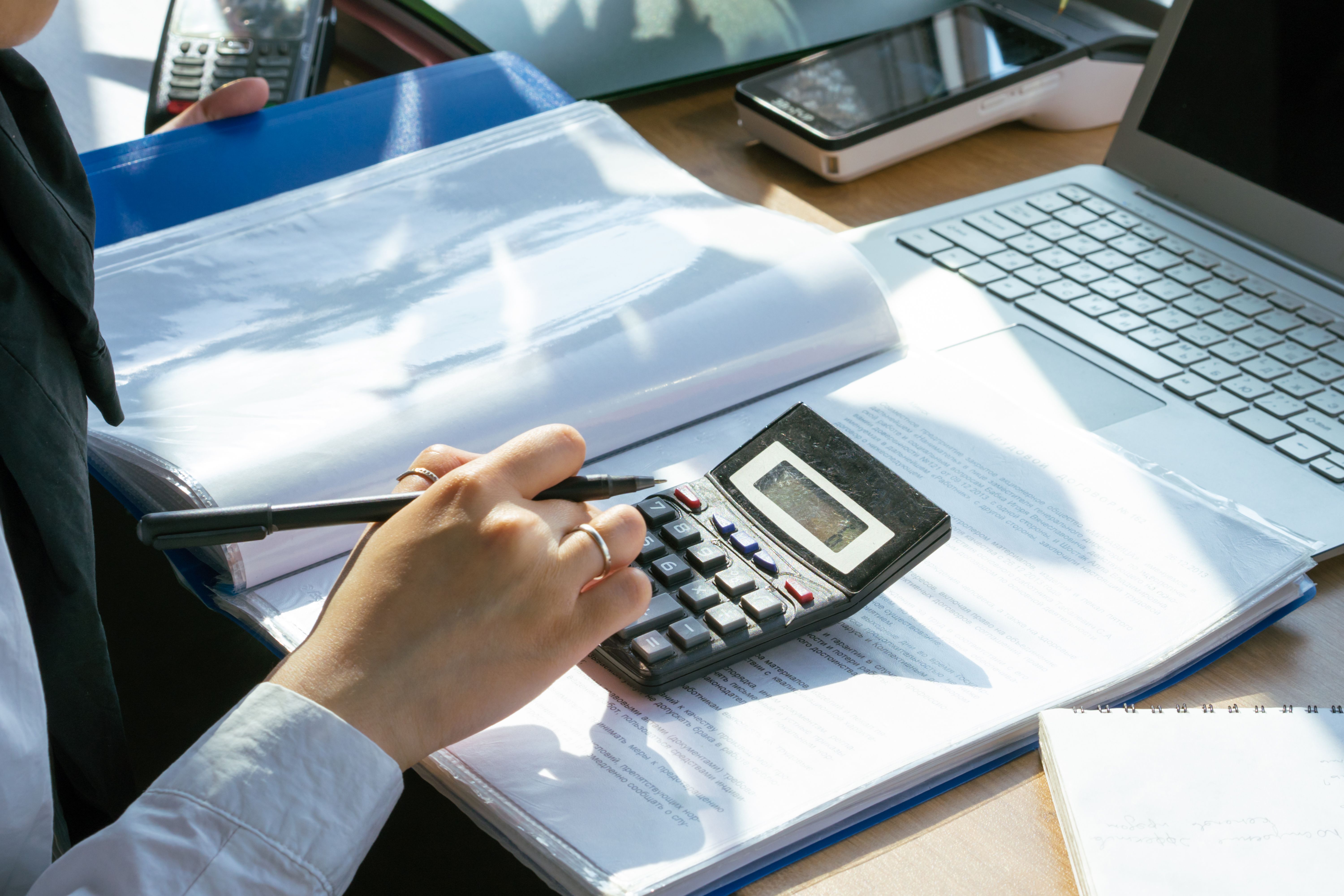 Bank reconciliation services shown with bank statement and QuickBooks reconciliation screen being matched line by line.