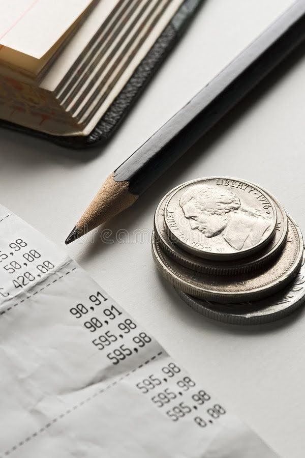 Monthly bookkeeping services workspace with QuickBooks dashboard, monthly reports, and desk calendar for small businesses.